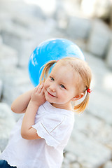 Image showing Little girl with blue balloon