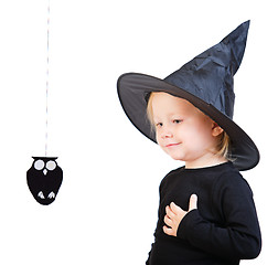 Image showing Toddler girl in black little witch costume