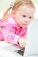 Image showing Little girl with laptop