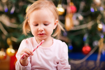 Image showing Toddler girl with Christmas candy