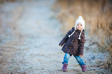 Image showing Little girl outdoors on winter day