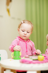 Image showing Little girl playing with toys