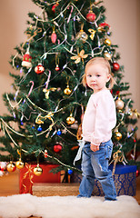 Image showing Toddler girl near Christmas tree