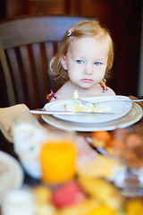 Image showing Toddler girl having breakfast