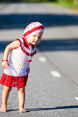 Image showing Playful toddler girl on road