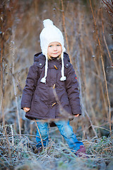 Image showing Little girl outdoors on winter day