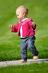 Image showing Baby girl walking