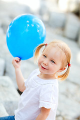 Image showing Little girl with blue balloon