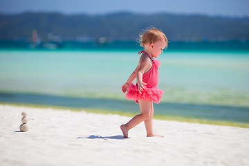 Image showing Toddler girl playing at beach