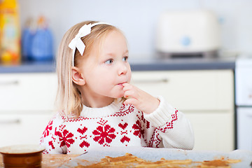 Image showing Little girl at kitchen