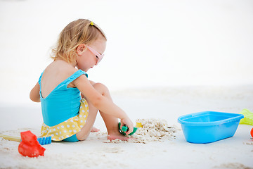Image showing Little girl playing at beach