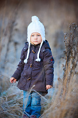 Image showing Little girl outdoors on winter day