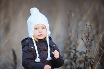 Image showing Little girl outdoors on winter day