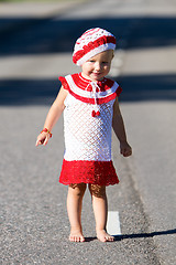 Image showing Playful toddler girl on road