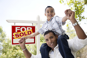 Image showing Hispanic Father and Son with Sold Real Estate Sign