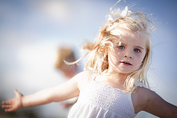 Image showing Adorable Blue Eyed Girl Playing Outside