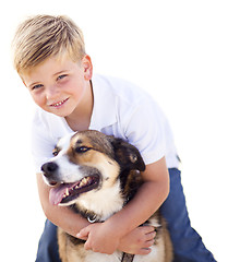 Image showing Handsome Young Boy Playing with His Dog Isolated