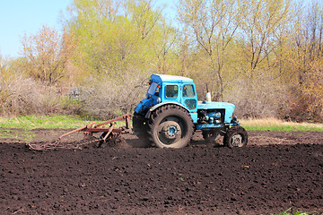 Image showing old tractor with plough