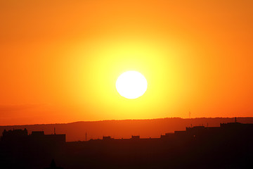 Image showing orange sunset over town
