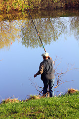 Image showing fishing senior on lake