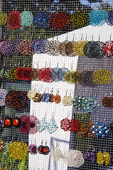 Image showing Many colorful handmade earrings sale market fair 