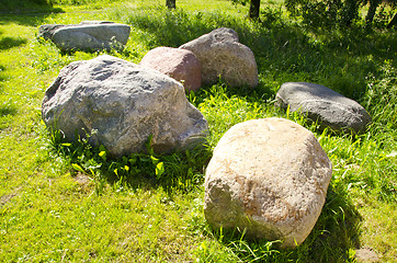 Image showing Large stones garden verdant meadow rural scenery 