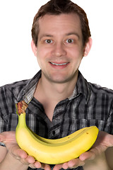 Image showing Man giving a banana