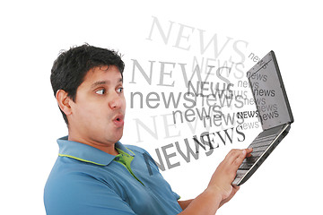 Image showing Man in laptop with the word news coming out of the screen 