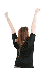 Image showing Beautiful happy young woman with her arms in the air. Isolated o