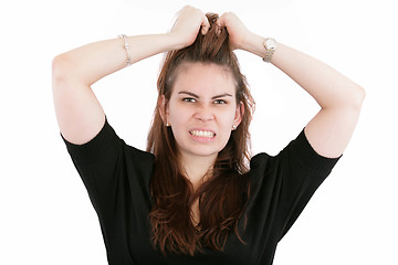 Image showing Stress. Business woman frustrated and stressed pulling her hair.