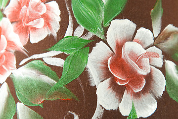 Image showing flower print on brown fabric