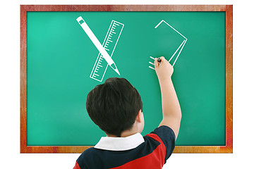 Image showing Boy in classroom thinking, writing and counting on board