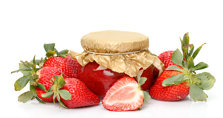 Image showing Fresh Strawberries with jam-jar closeup