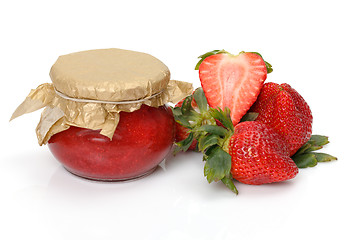 Image showing Fresh Strawberries with jam-jar closeup