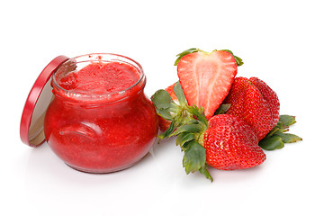 Image showing Fresh Strawberries with jam-jar closeup