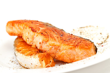 Image showing Fried salmon fillets with sauce