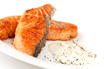 Image showing Fried salmon fillets with sauce