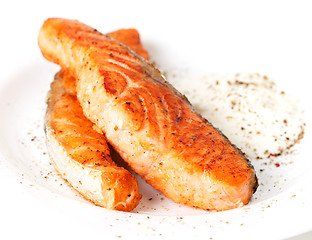 Image showing Fried salmon fillets with sauce