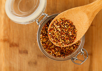 Image showing mixture spice in a wooden spoon
