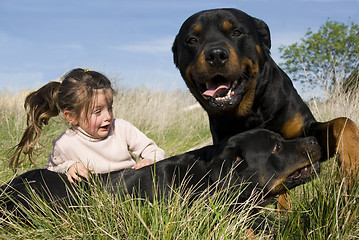 Image showing dangerous dogs and child