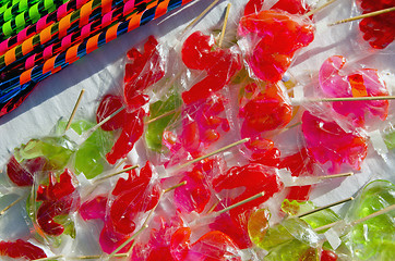 Image showing Various forms sucked lollipops sweets sold  fair 