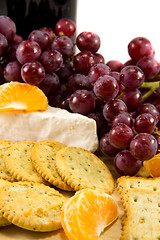 Image showing Crackers with grapes, brie, and some clementins