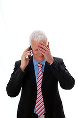 Image showing Businessman disappointed calling with hand on forehead