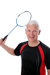 Image showing Senior with badminton racket over head