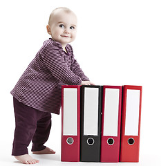 Image showing young child with four file folders