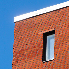 Image showing Red wall and blue sky