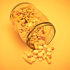 Image showing pills in glass container