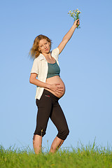 Image showing pregnant woman on meadow