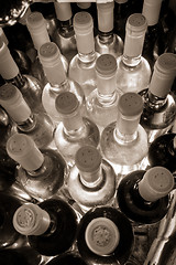 Image showing wine bottles stacked up