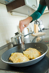 Image showing chef frying salmon steak